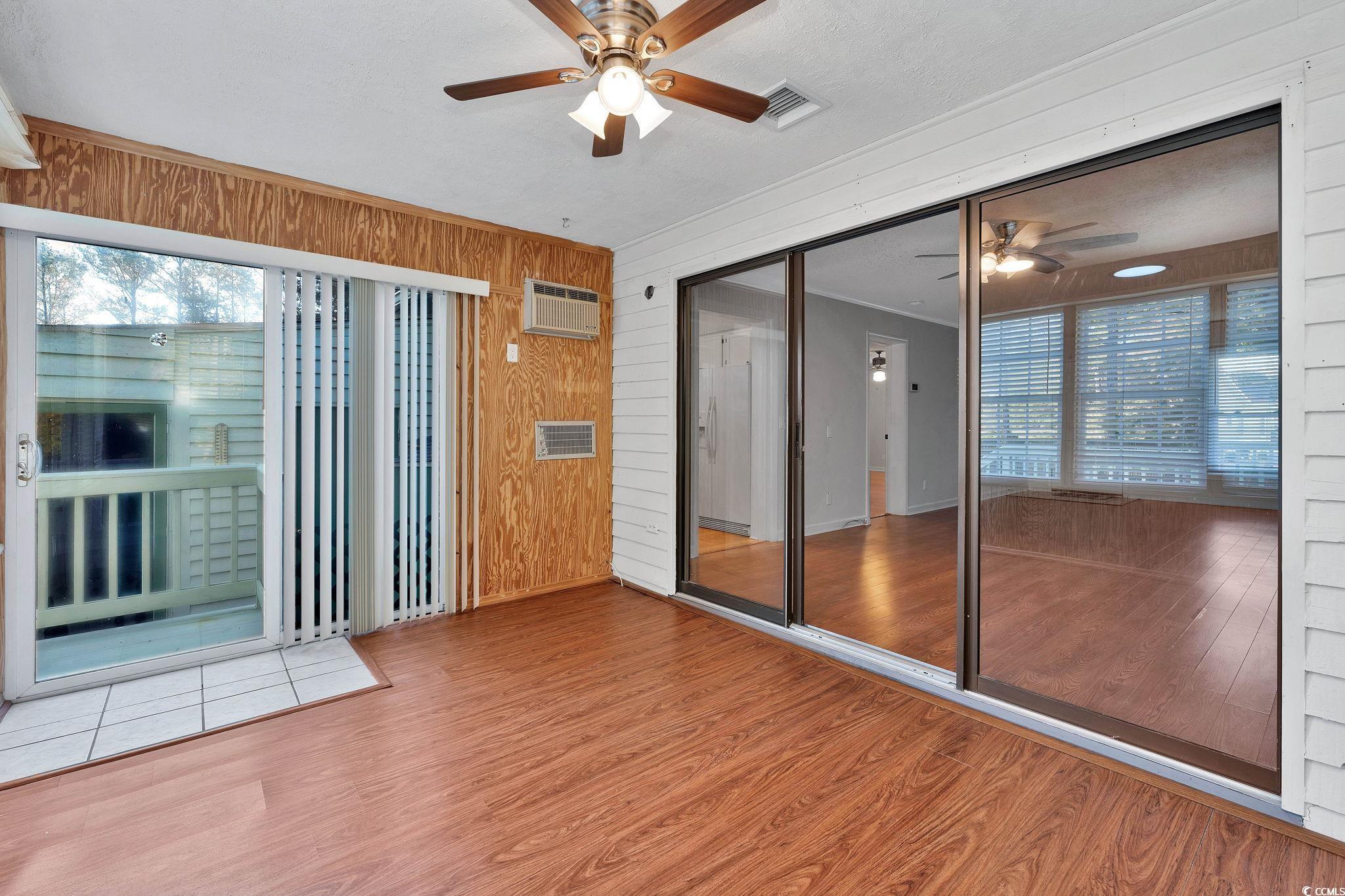 1305 Conifer Court Murrells Inlet, SC 29576 - Photo 7 of 30 Unfurnished sunroom with ceiling fan