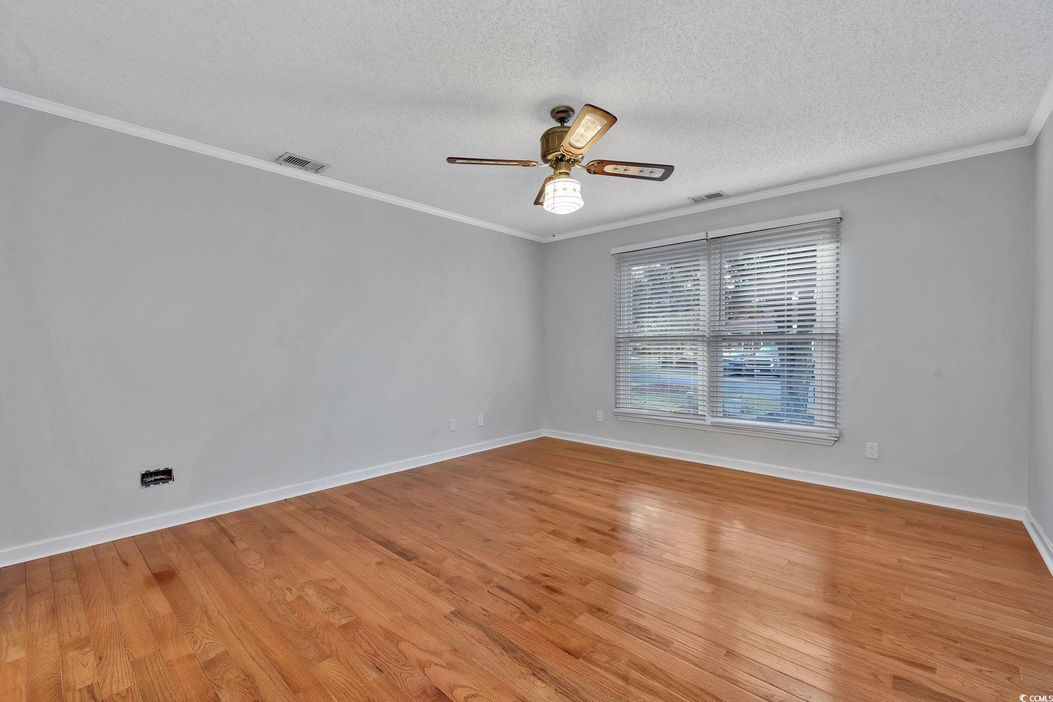 1305 Conifer Court Murrells Inlet, SC 29576 - Photo 8 of 30 Interior space featuring wood walls, ceiling fan,