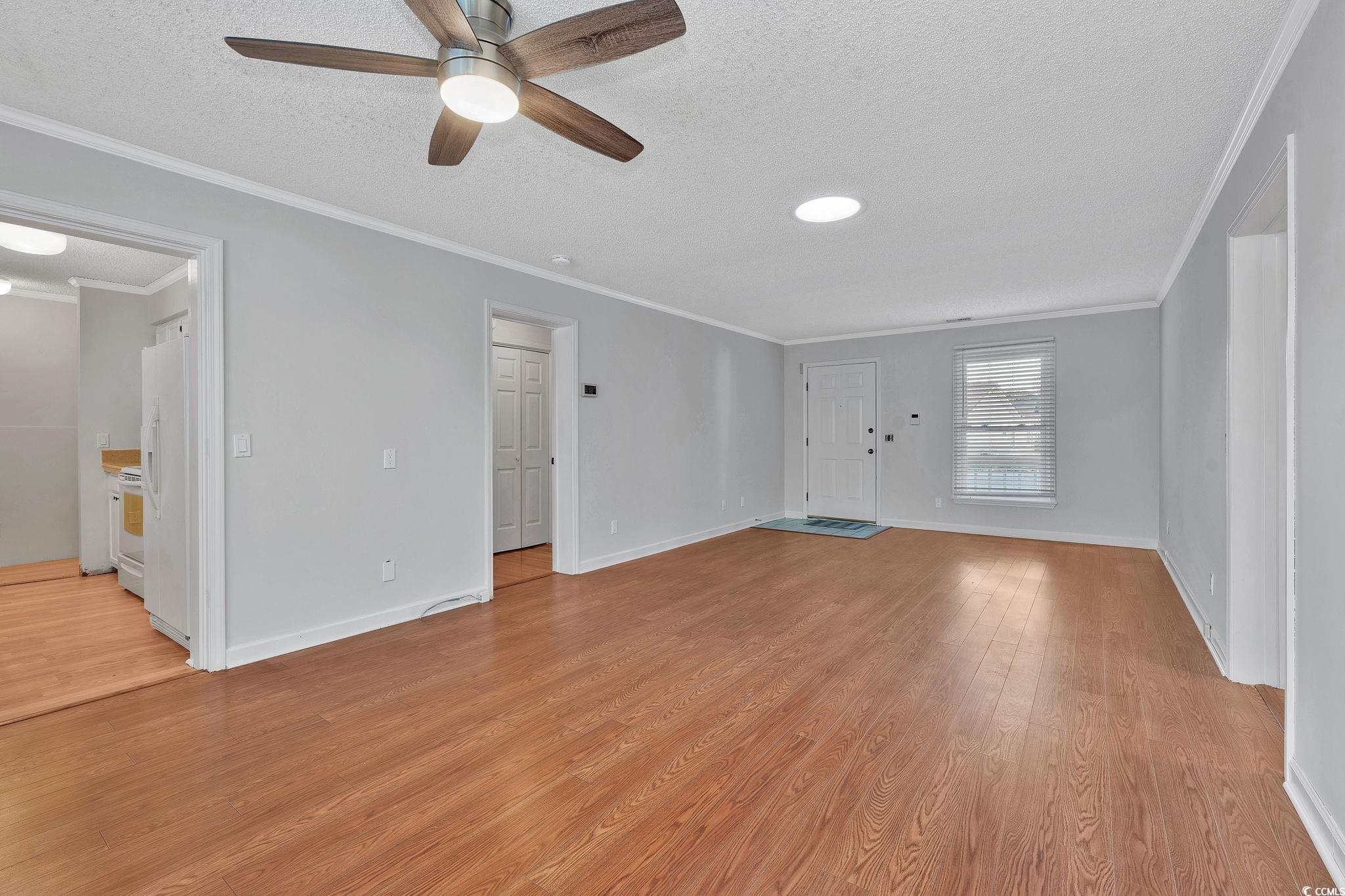 1305 Conifer Court Murrells Inlet, SC 29576 - Photo 10 of 30 Spare room featuring crown molding, ceiling fan, a