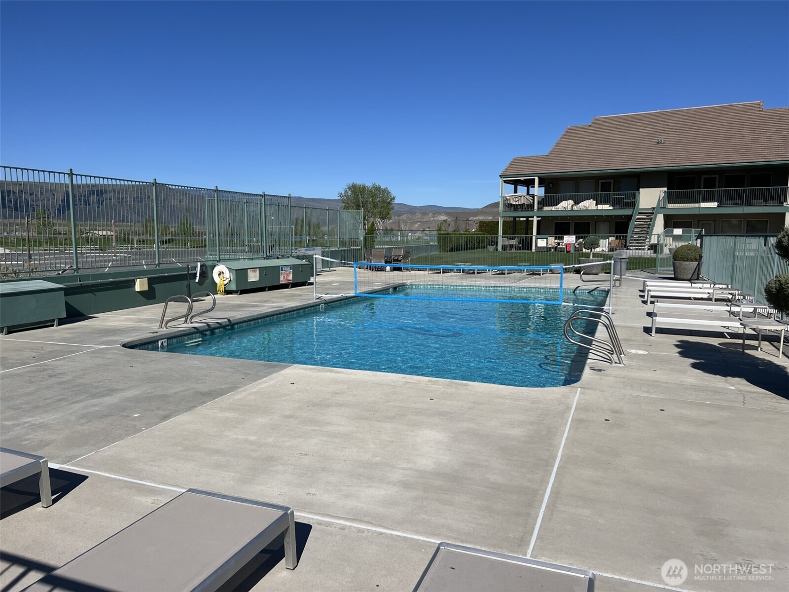 8997 Crescent Bar Road Northwest, Unit C118 Quincy, WA 98848 - Photo 29 of 33 a view of a patio with couches and pool