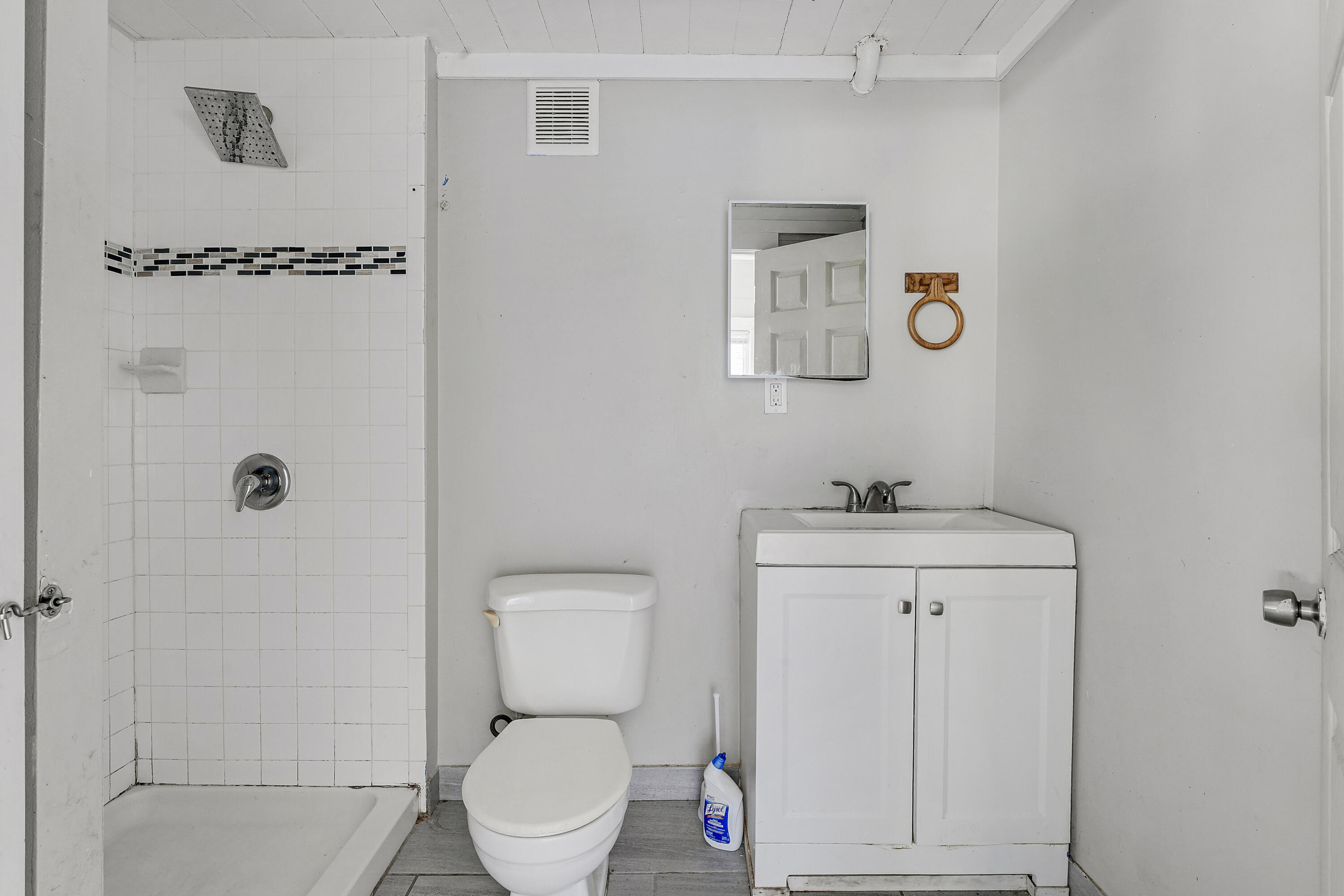 301 South 7th Street Fort Pierce, FL 34950 - Photo 11 of 15 a bathroom with a toilet a sink and vanity