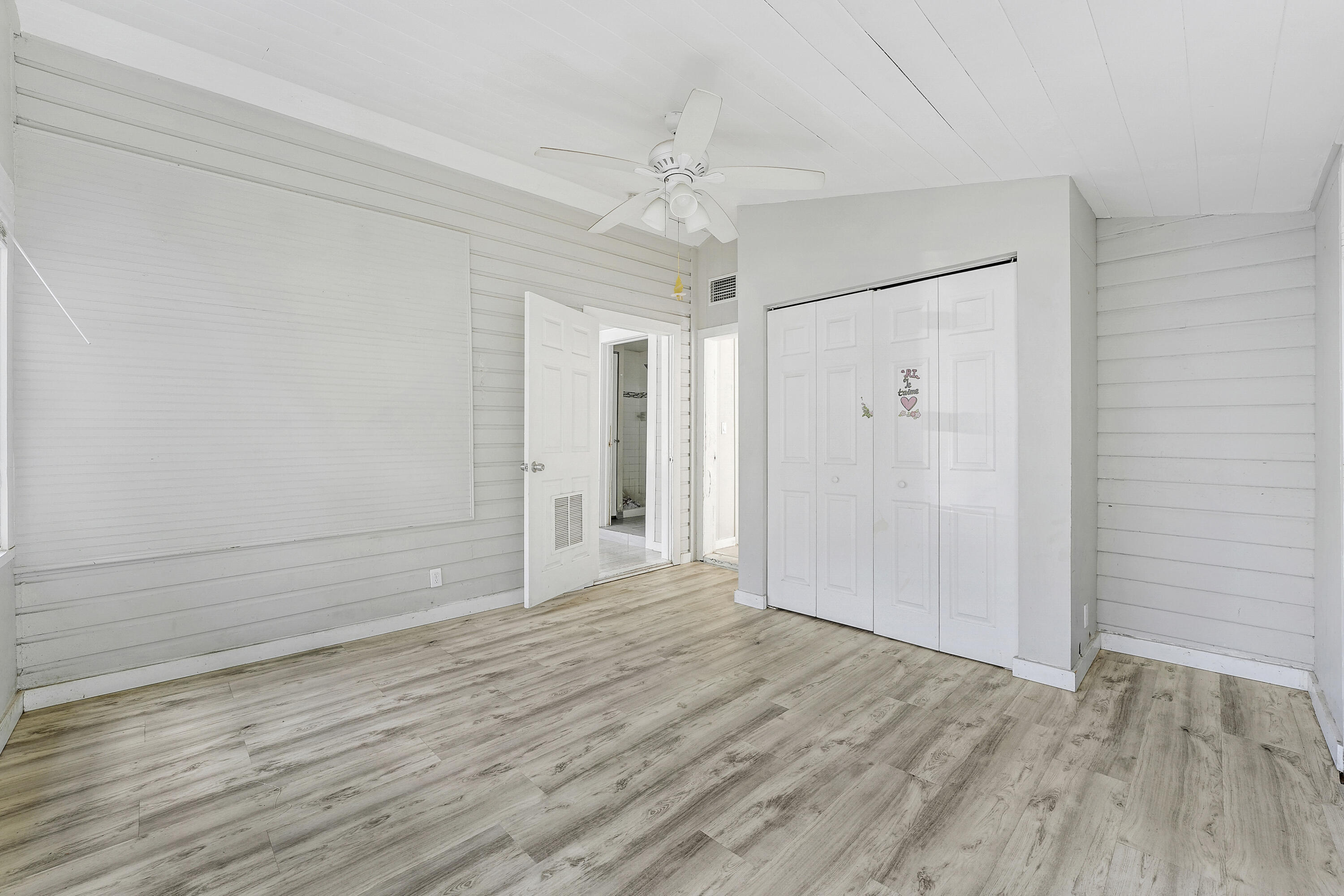301 South 7th Street Fort Pierce, FL 34950 - Photo 12 of 15 a view of an empty room with wooden floor