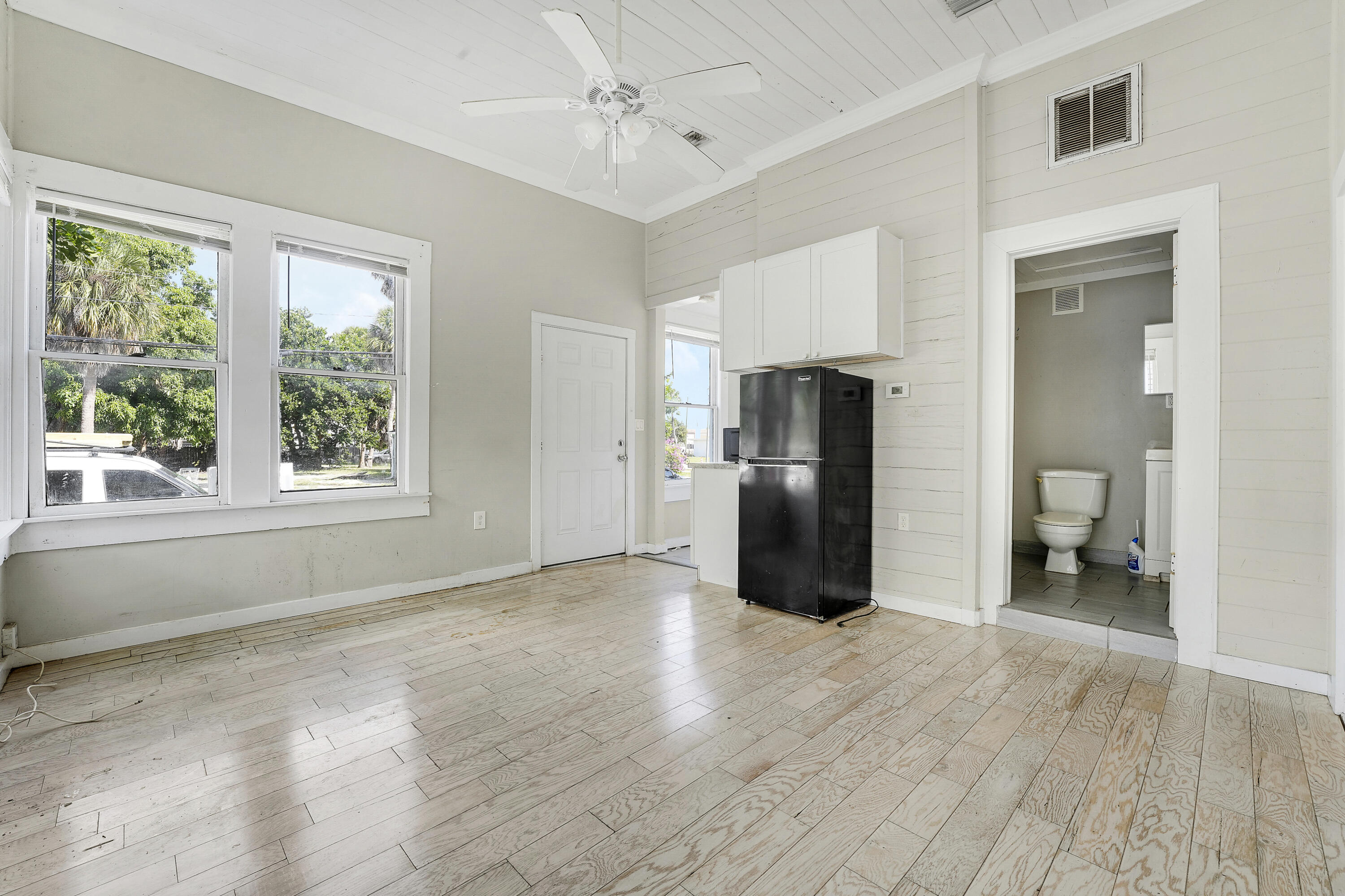 301 South 7th Street Fort Pierce, FL 34950 - Photo 7 of 15 a view of a storage & utility room with closet fridge and a window