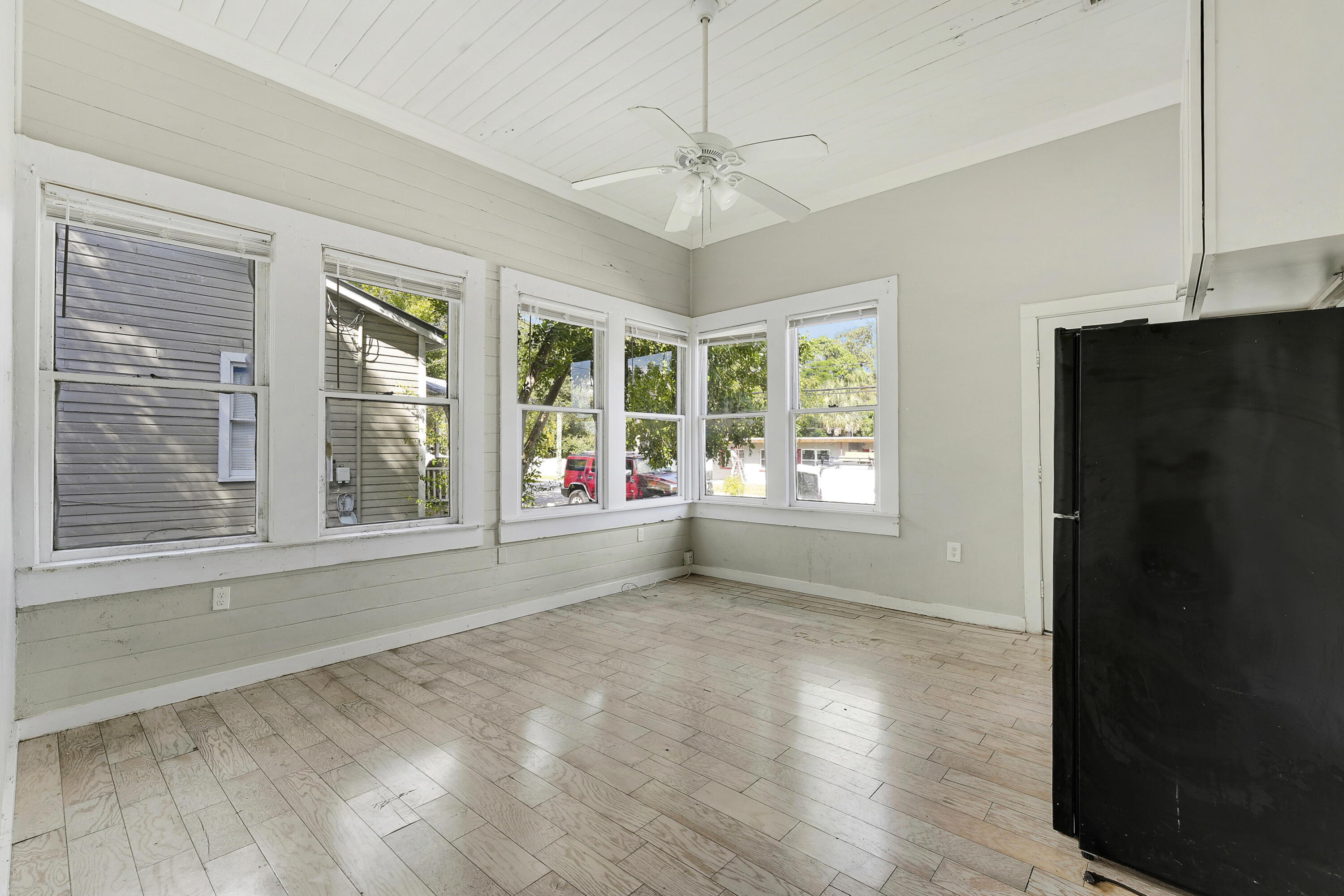301 South 7th Street Fort Pierce, FL 34950 - Photo 8 of 15 a view of an empty room with a window and wooden floor