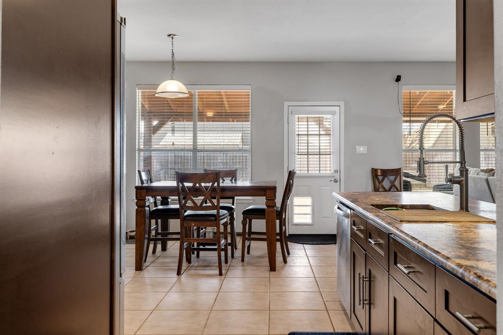 4029 Bridge Water Road Heartland, TX 75126 - Photo 11 of 39 a kitchen with a table and chairs