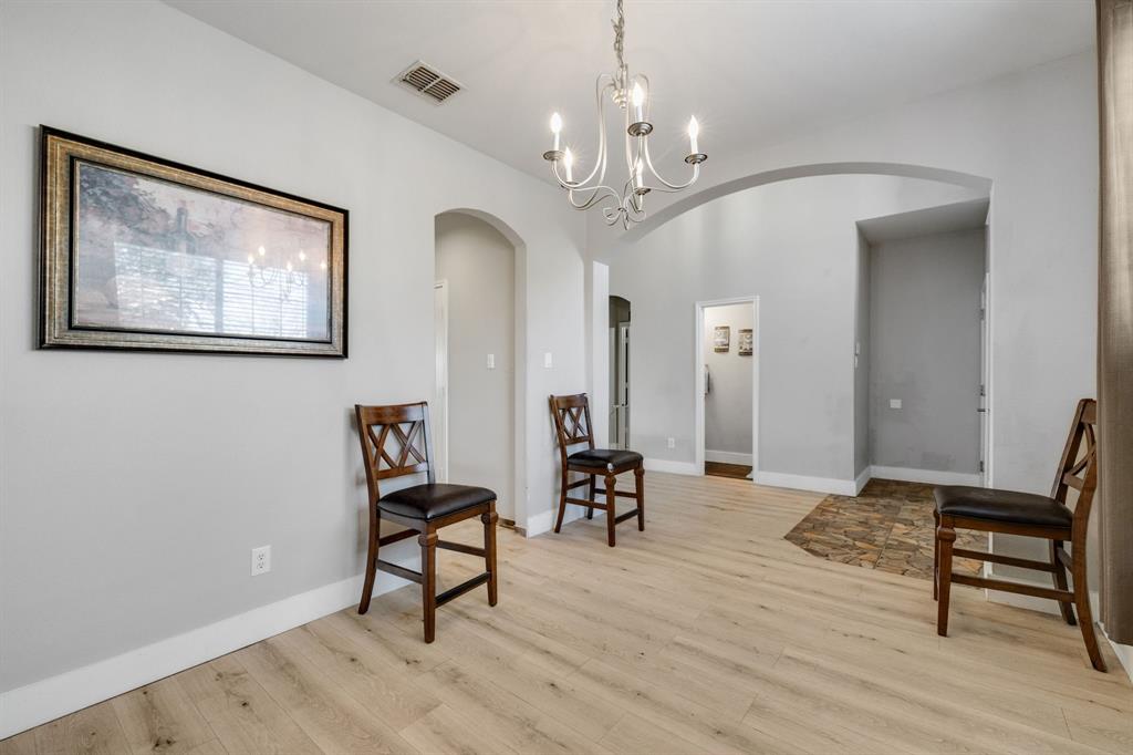 4029 Bridge Water Road Heartland, TX 75126 - Photo 2 of 39 a view of a livingroom with furniture and a chandelier