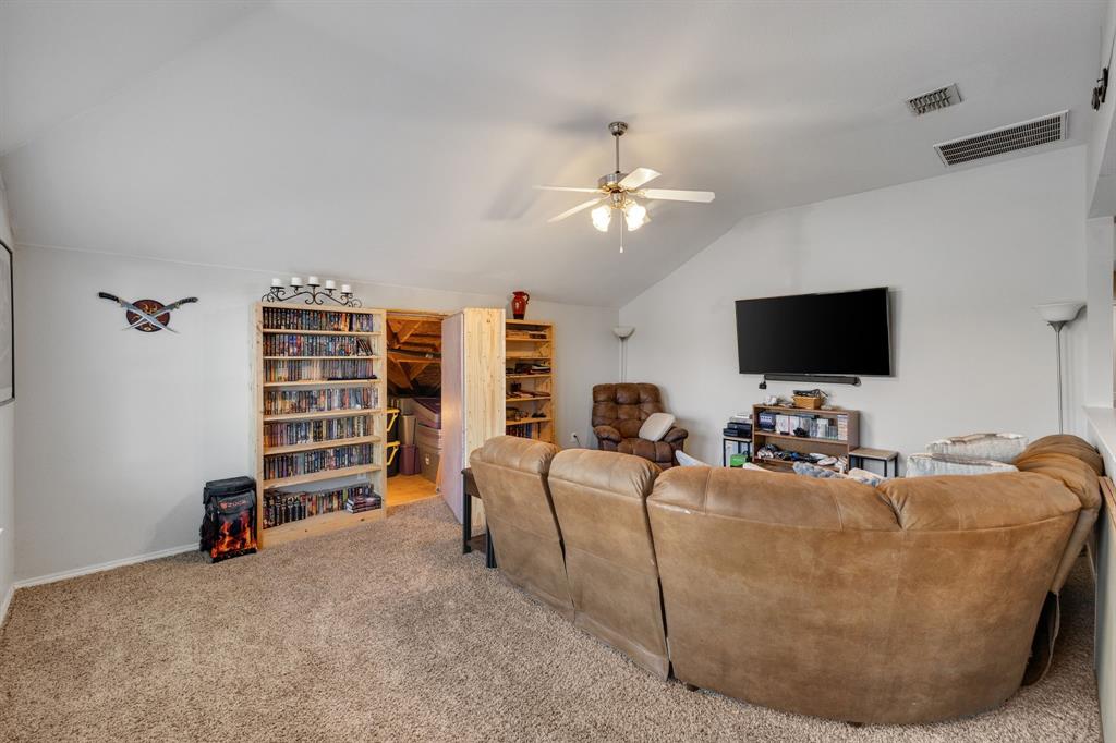 4029 Bridge Water Road Heartland, TX 75126 - Photo 26 of 39 Upstairs is a large game room with walk-out access to floored attic storage.