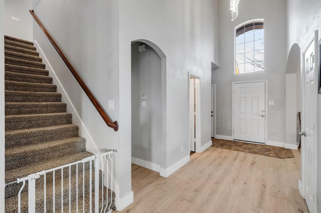 4029 Bridge Water Road Heartland, TX 75126 - Photo 9 of 39 a view of an entryway with staircase