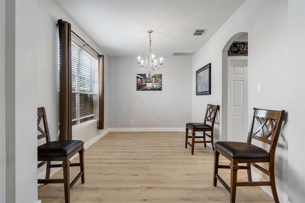 4029 Bridge Water Road Heartland, TX 75126 - Photo 10 of 39 a view of a livingroom with furniture window and wooden floor