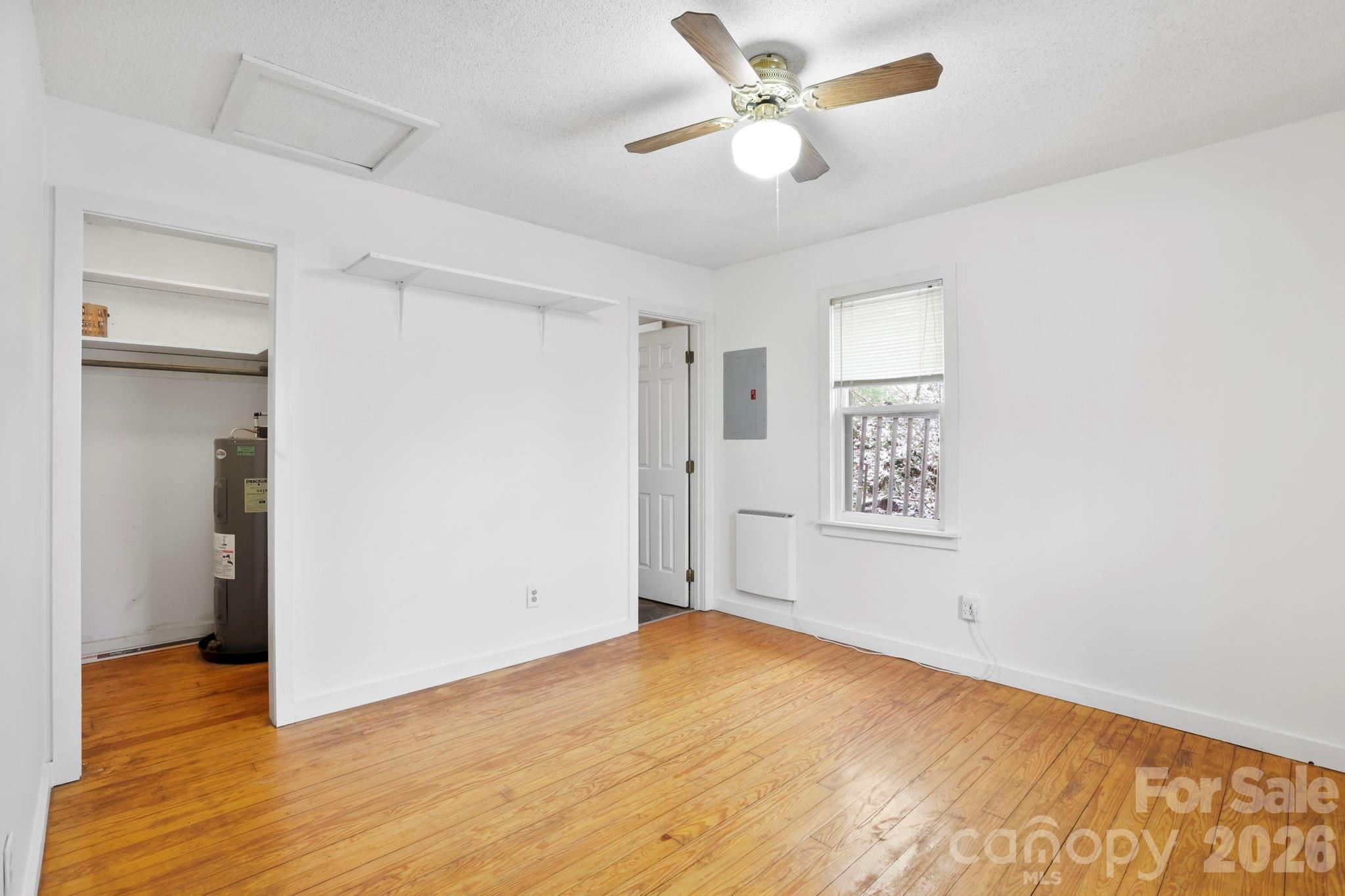 186 Greentree Lane Canton, NC 28716 - Photo 11 of 32 wooden floor in an empty room with a window