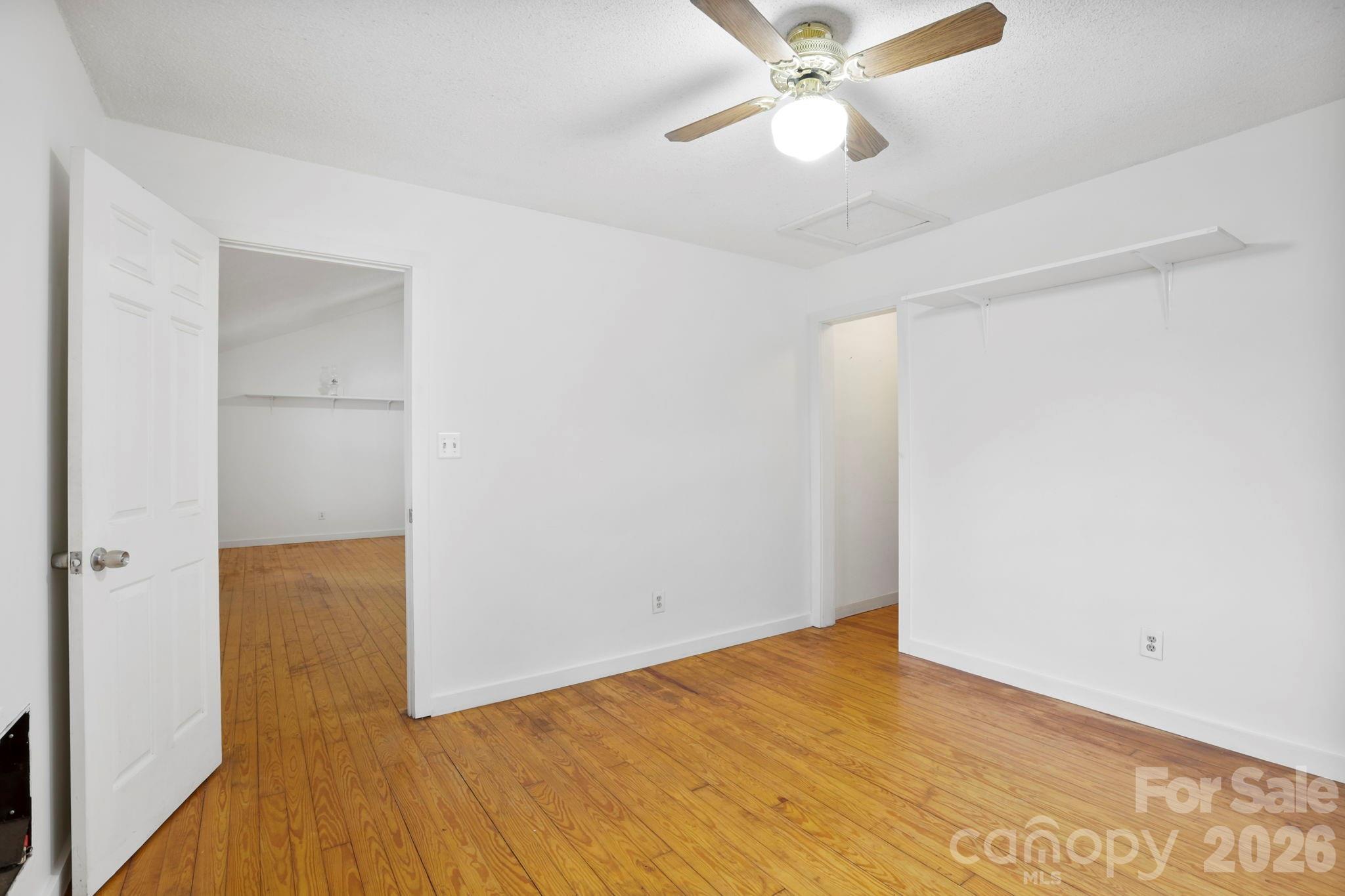 186 Greentree Lane Canton, NC 28716 - Photo 12 of 32 a view of an empty room with wooden floor