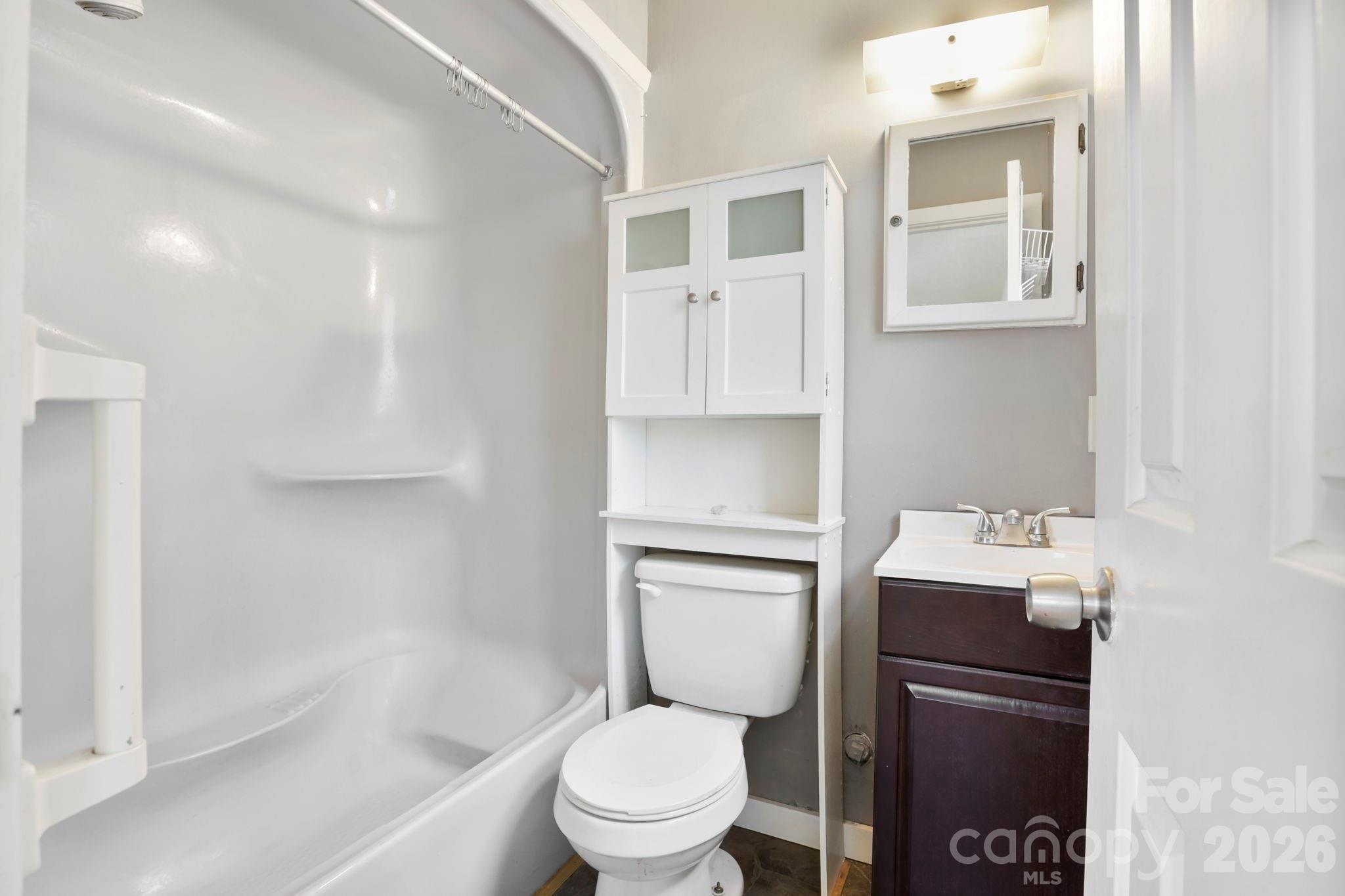 186 Greentree Lane Canton, NC 28716 - Photo 15 of 32 a bathroom with a sink a toilet and shower