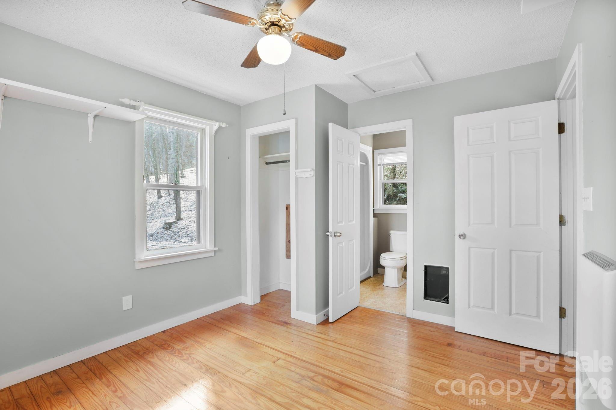 186 Greentree Lane Canton, NC 28716 - Photo 17 of 32 a view of an empty room with window and wooden floor