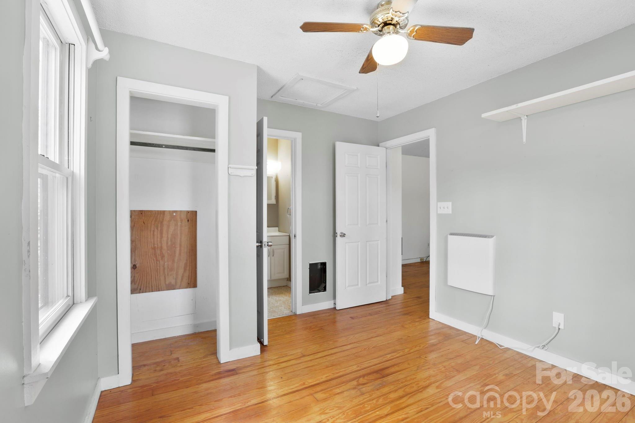 186 Greentree Lane Canton, NC 28716 - Photo 18 of 32 a view of empty room with wooden floor and fan