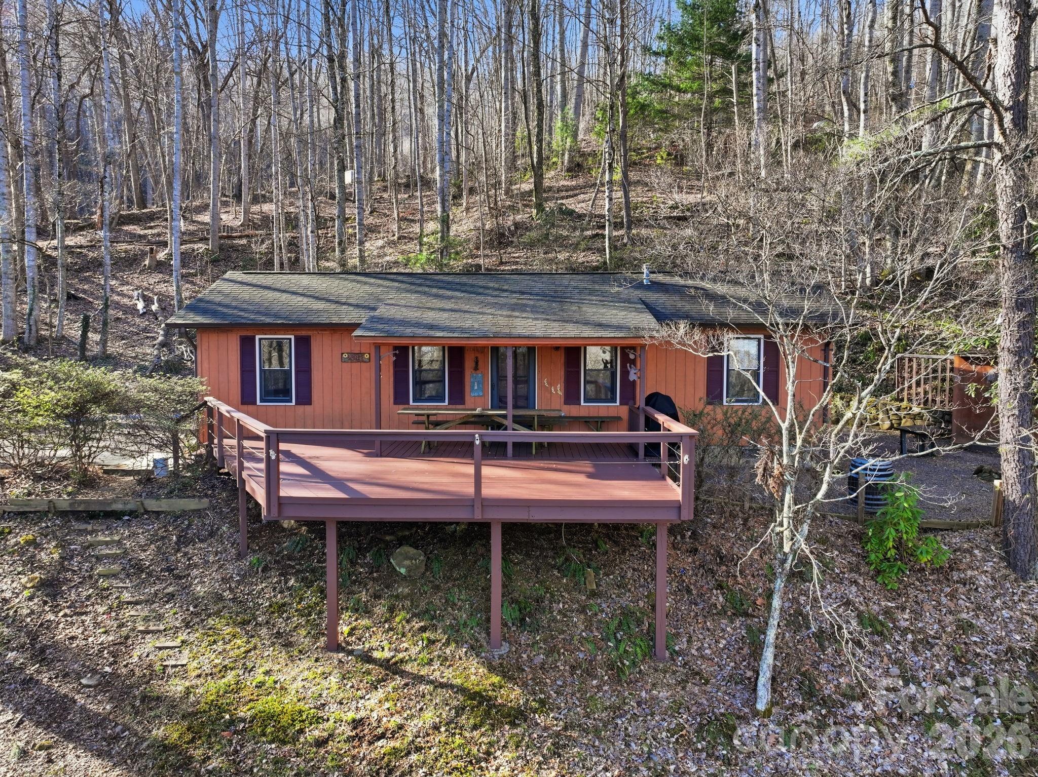 186 Greentree Lane Canton, NC 28716 - Photo 24 of 32 a backyard of a house with table and chairs