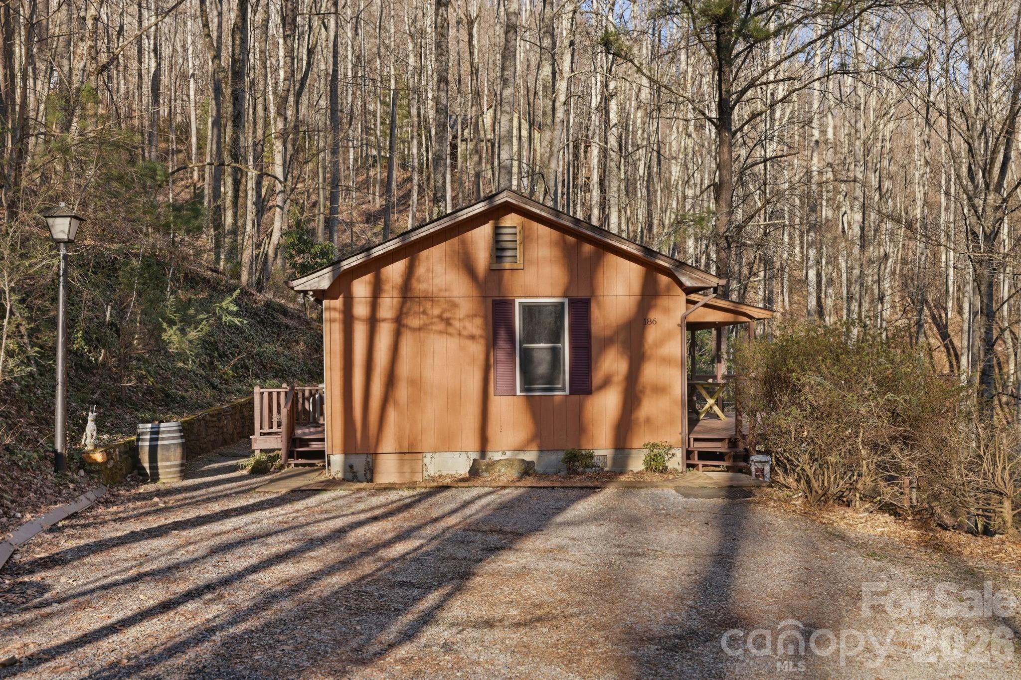 186 Greentree Lane Canton, NC 28716 - Photo 26 of 32 a view of a house with a yard