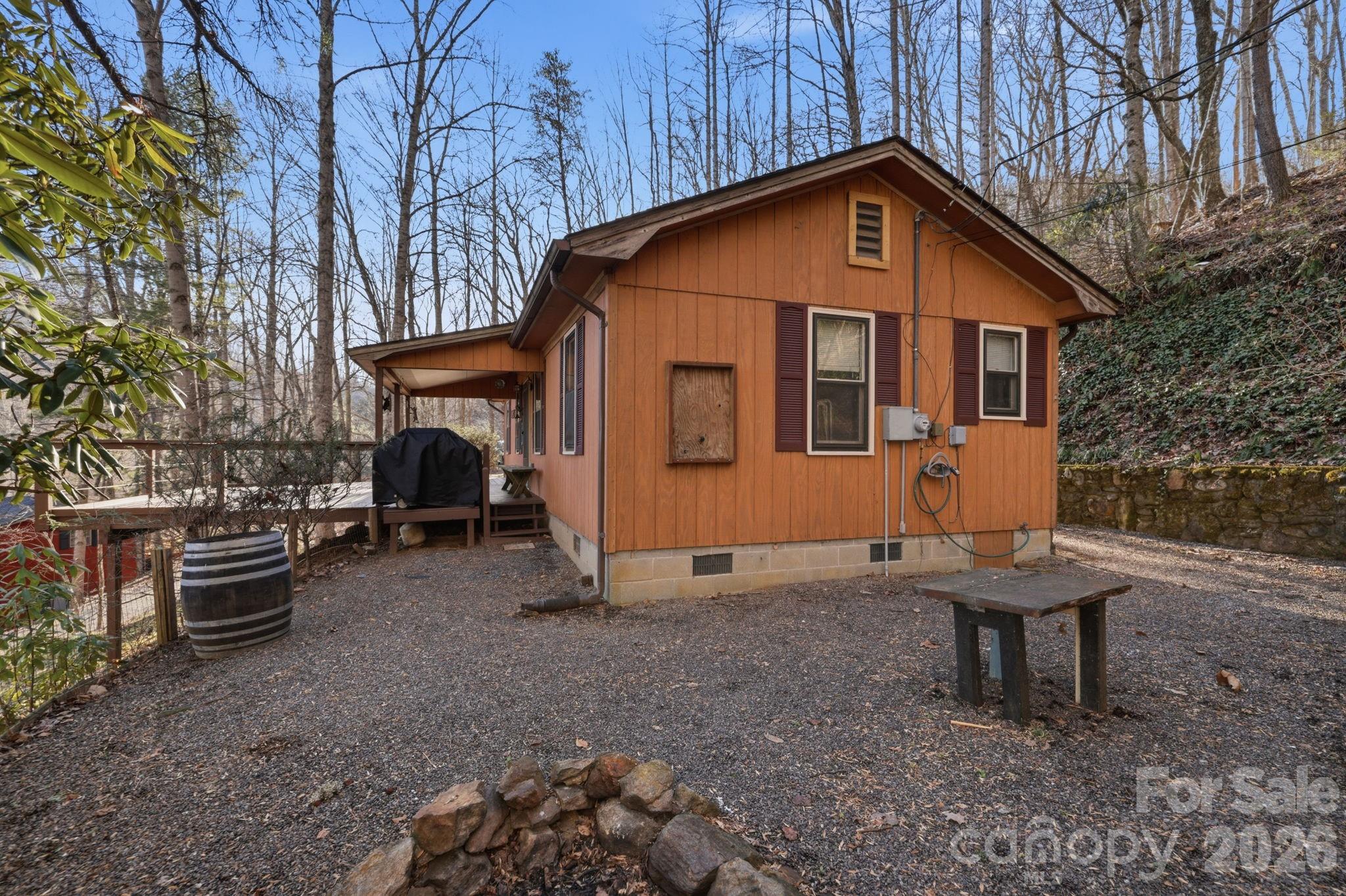 186 Greentree Lane Canton, NC 28716 - Photo 30 of 32 a view of a house with backyard and chairs