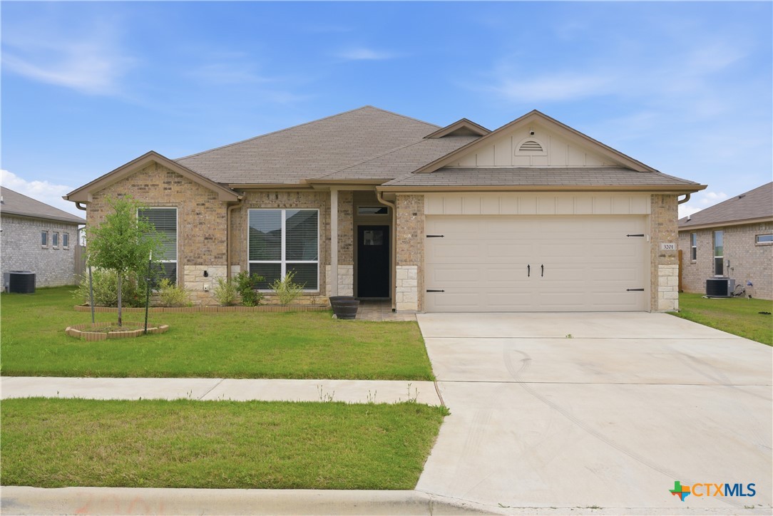3201 Hedwig Street Killeen, TX 76549 - Photo 2 of 38 front view of a house with a yard