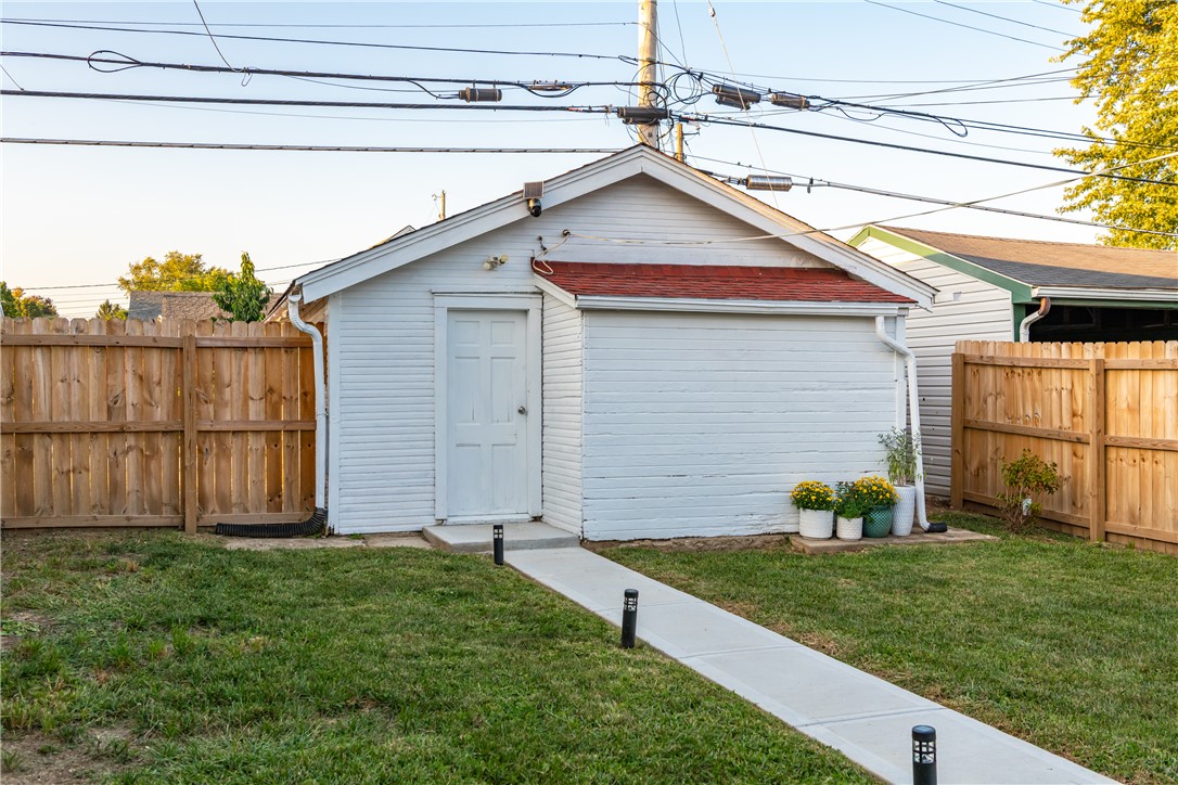 1915 Patterson Road Dayton, OH 45420 - Photo 43 of 48 This outdoor shed offers practical storage and functionality, complemented by a neatly fenced yard.