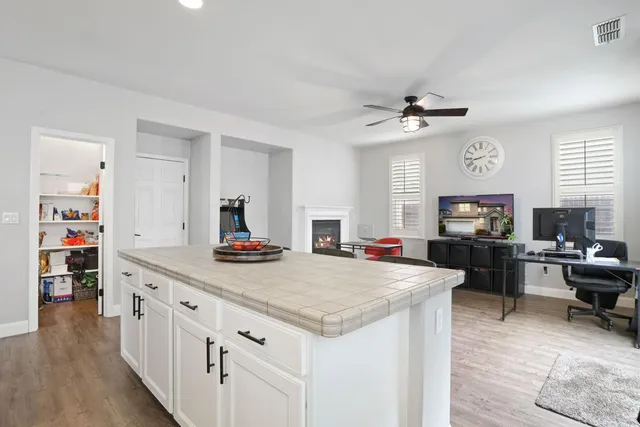 a living room with furniture a rug and a window
