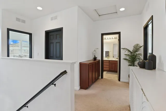 a kitchen with stainless steel appliances a refrigerator and a microwave