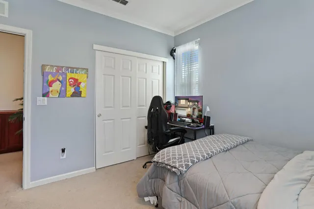 a bathroom with a double vanity sink mirror and toilet