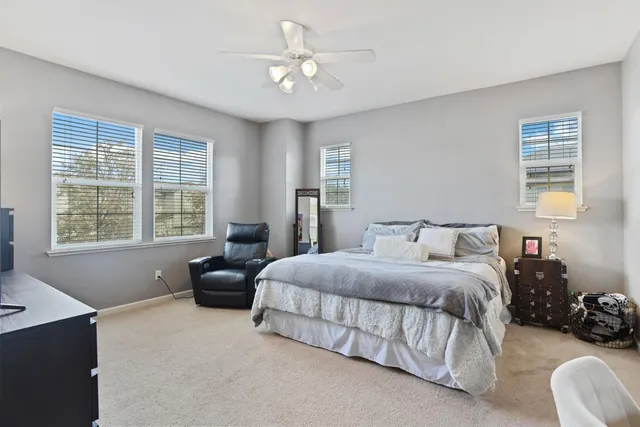 a bedroom with a bed and a television