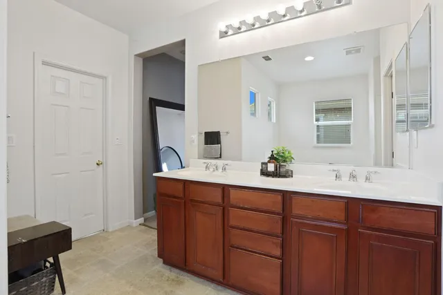 a bathroom with a bathtub and a window