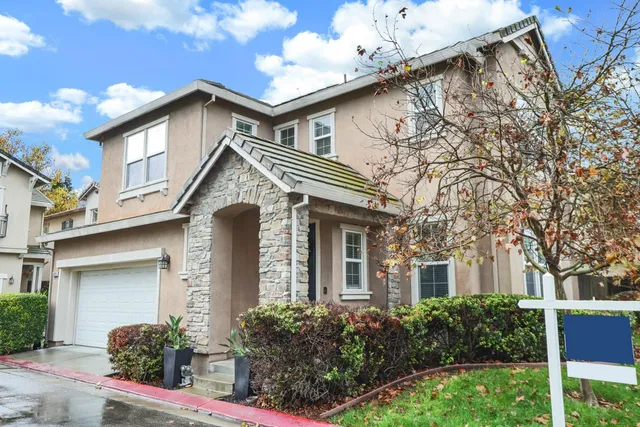 a front view of a house with a garage