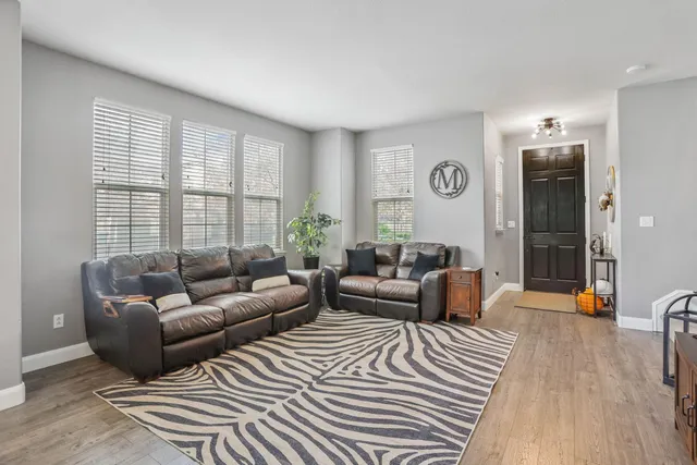 a bedroom with furniture and a flat screen tv