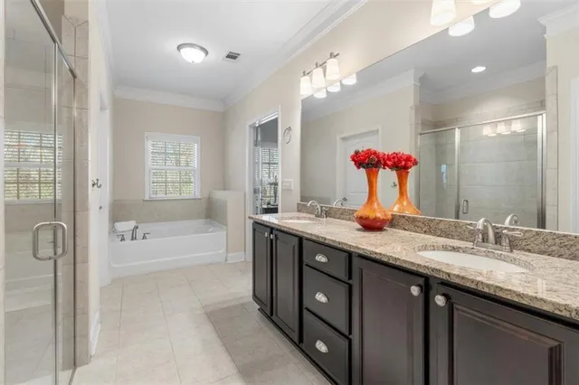 a bathroom with a sink a toilet a mirror and shower curtain