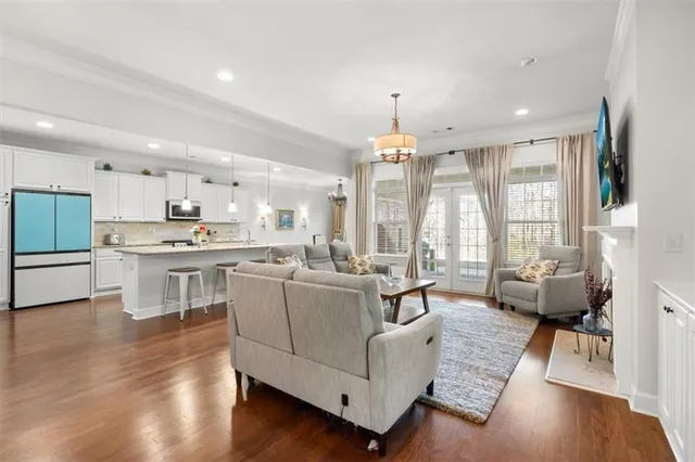 a living room with furniture fireplace and flat screen tv