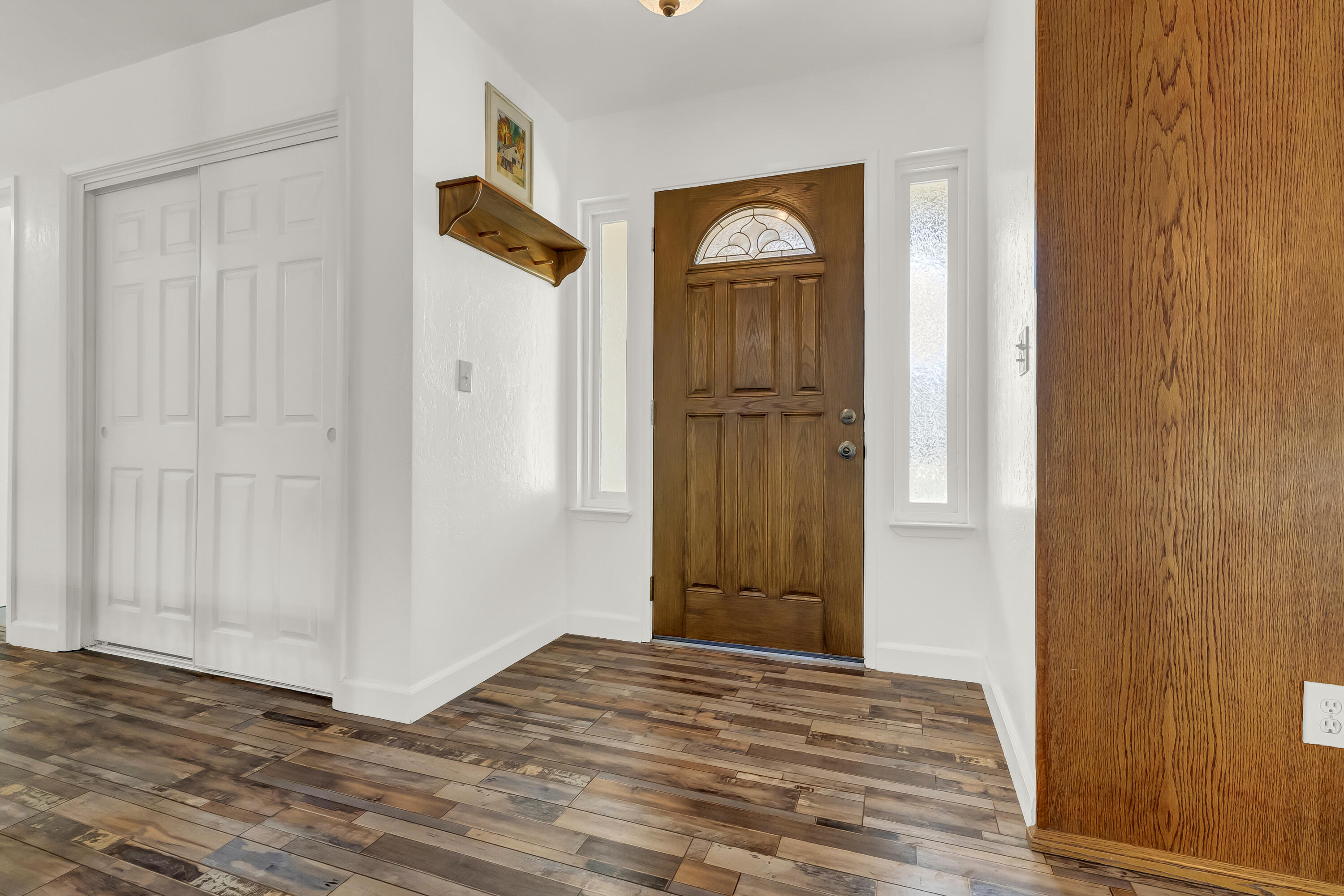 18002 320th Road Springville, CA 93265 - Photo 17 of 56 a view of a hallway with wooden floor and front door
