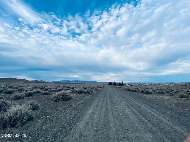 a view of an ocean beach and mountain
