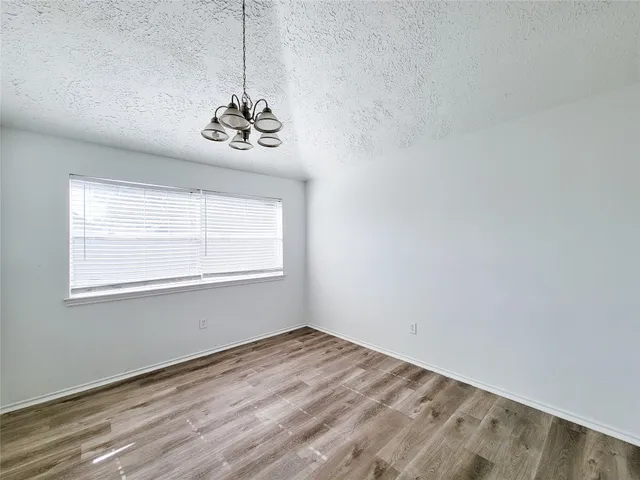 a view of a room with wooden floor and staircase