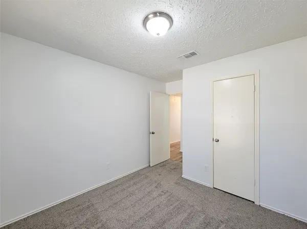 an empty room with a empty space and a window