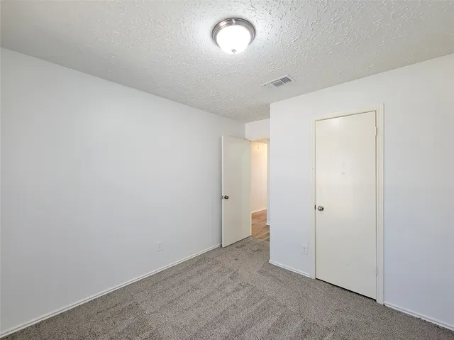 an empty room with a empty space and a window