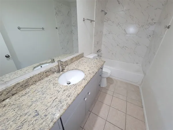 an empty room with a empty space and windows