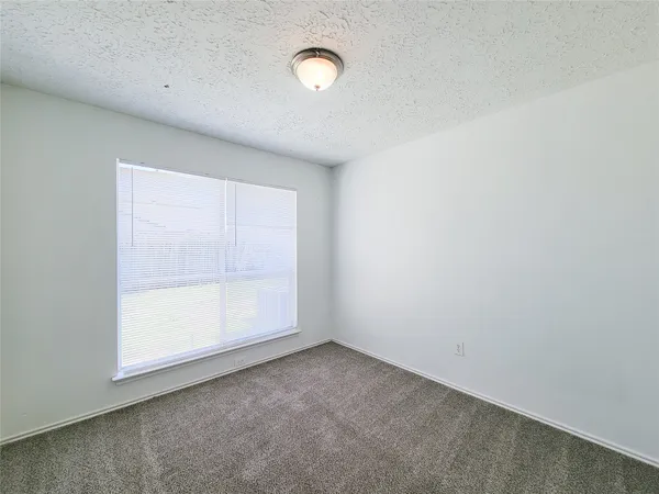 a view of empty room with windows