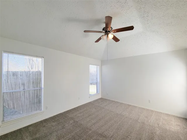 a bathroom with a granite countertop sink and mirror