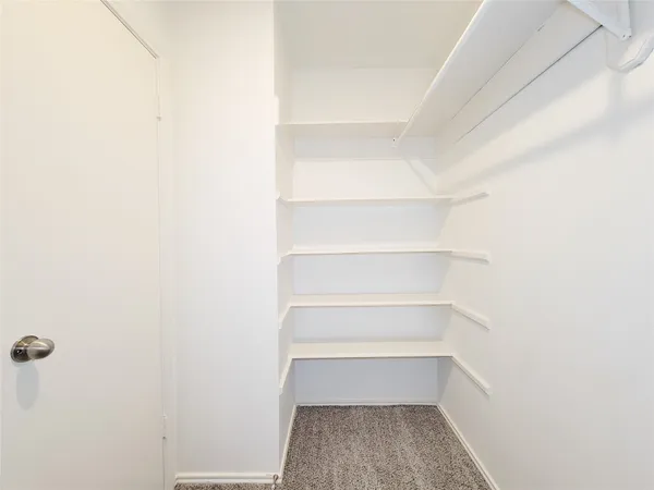a bathroom with a granite countertop sink a mirror and a bathtub