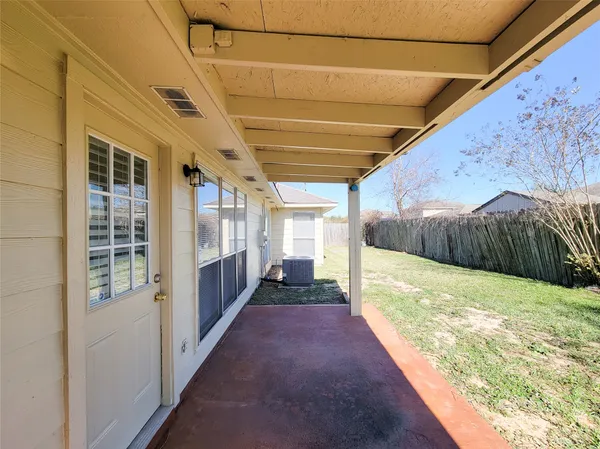 a house with trees in the background