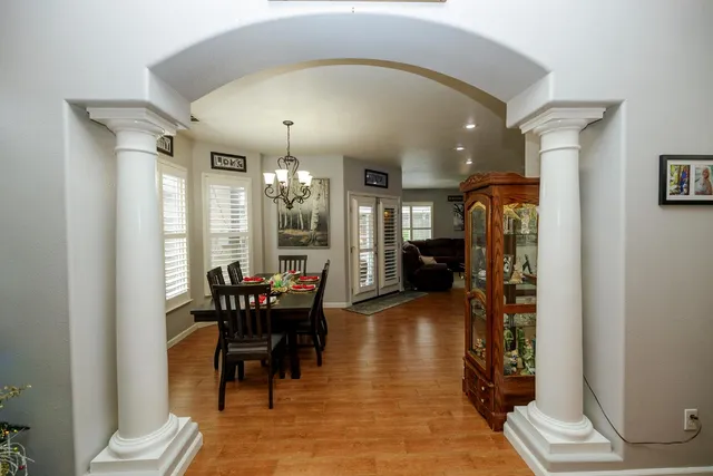 a view of a dining room with furniture window and wooden floor
