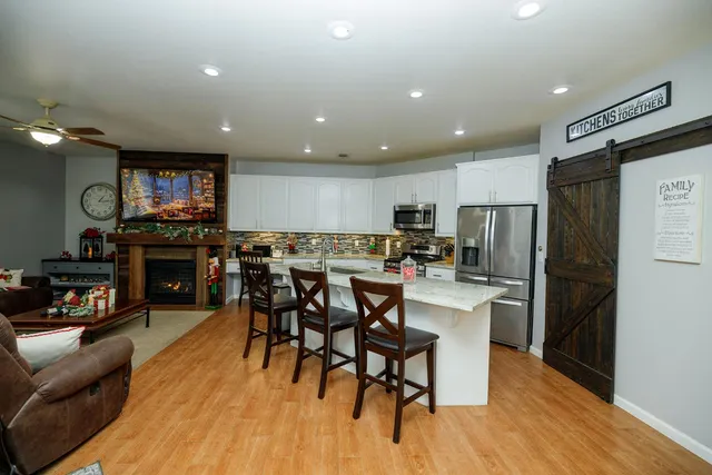 a view of a dining room with furniture and wooden floor