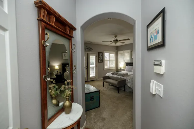 a bedroom with a large bed and a window