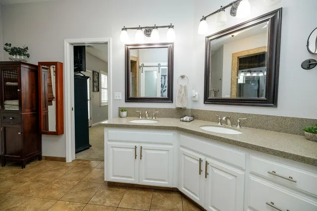 a kitchen with a sink and cabinets