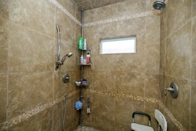 a bedroom with furniture and a chandelier