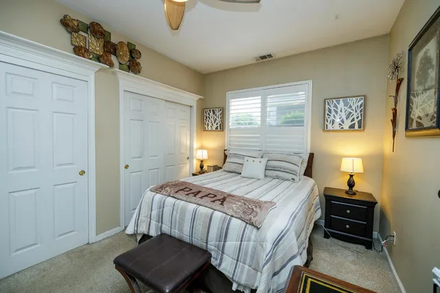 a view of a patio with couches table and chairs with wooden floor