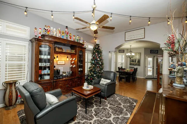 a lobby with furniture and chandelier