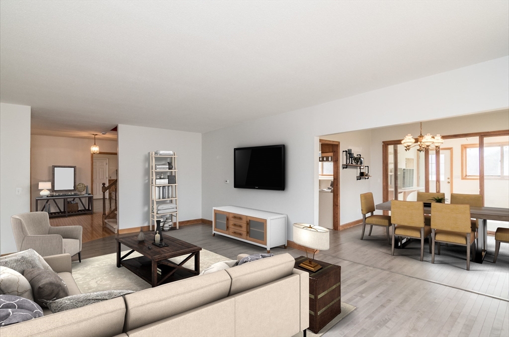 89 Potwine Lane Amherst, MA 01002 - Photo 11 of 37 a living room with furniture and a flat screen tv